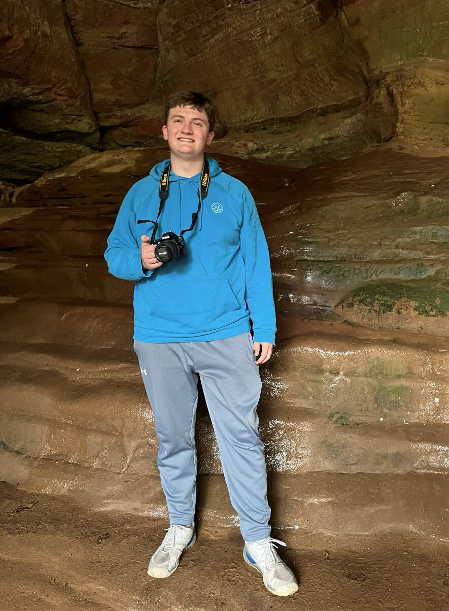 Picture of Drake in cave with a camera
